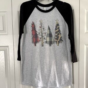 4 Christmas shirts. 1 large and 3 medium.